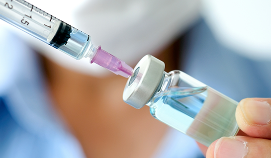 Filling a syringe with liquid used for BOTOX treatment