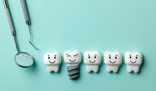 Foam teeth and dental implant with smiling faces