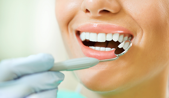 Having teeth examined at dental checkup for preventive dentistry in Riverdale Park